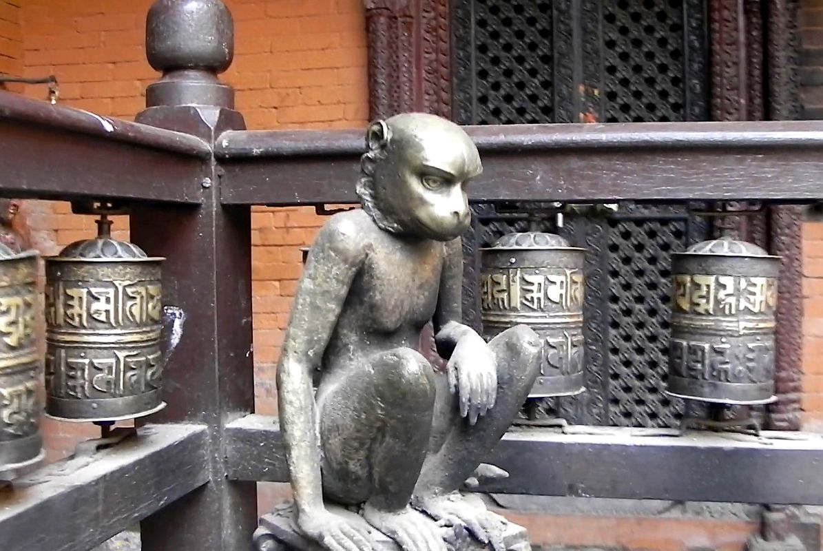 Kathmandu Patan Golden Temple 09 Monkey Statue To Left of Entrance 
